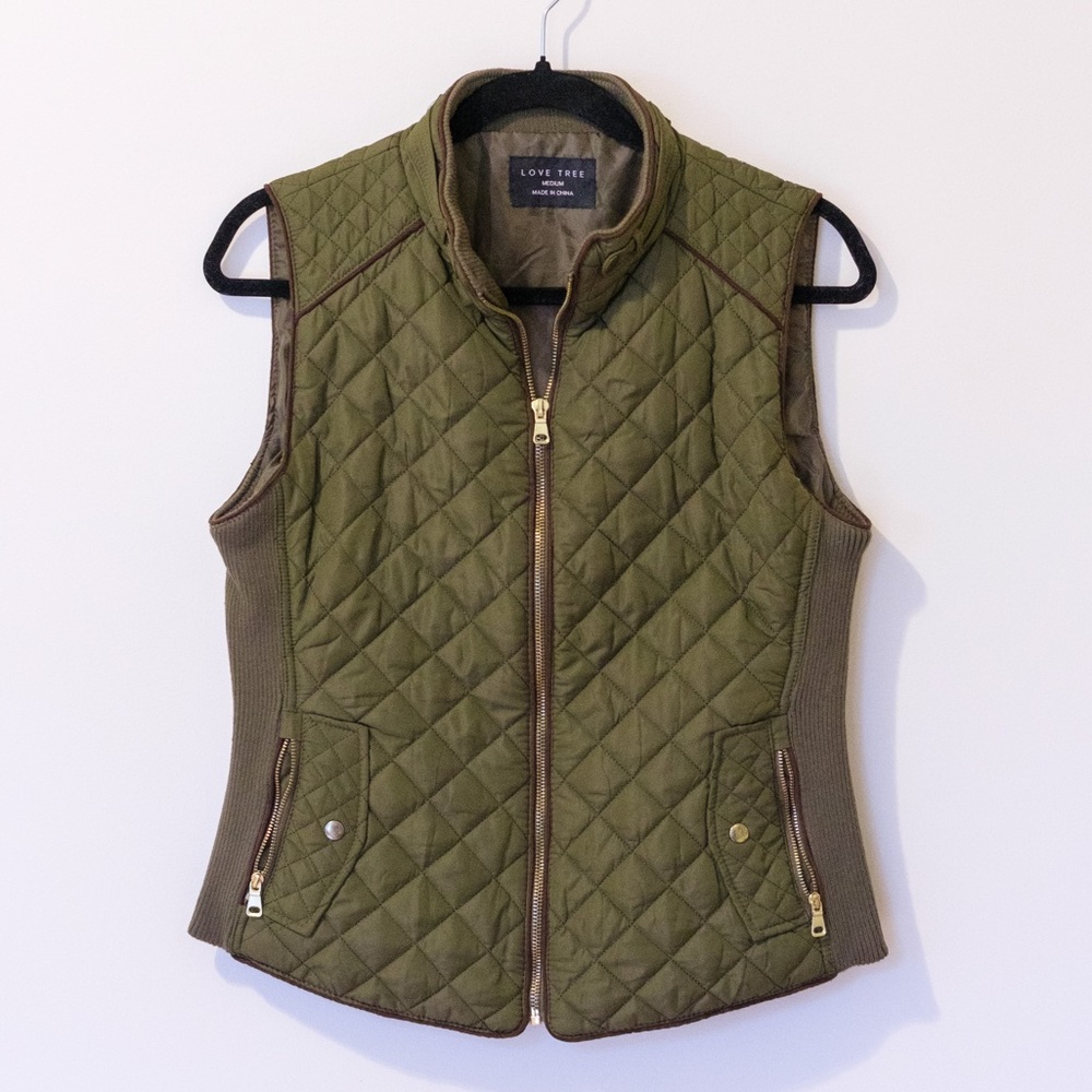 Green vest with gold hardware